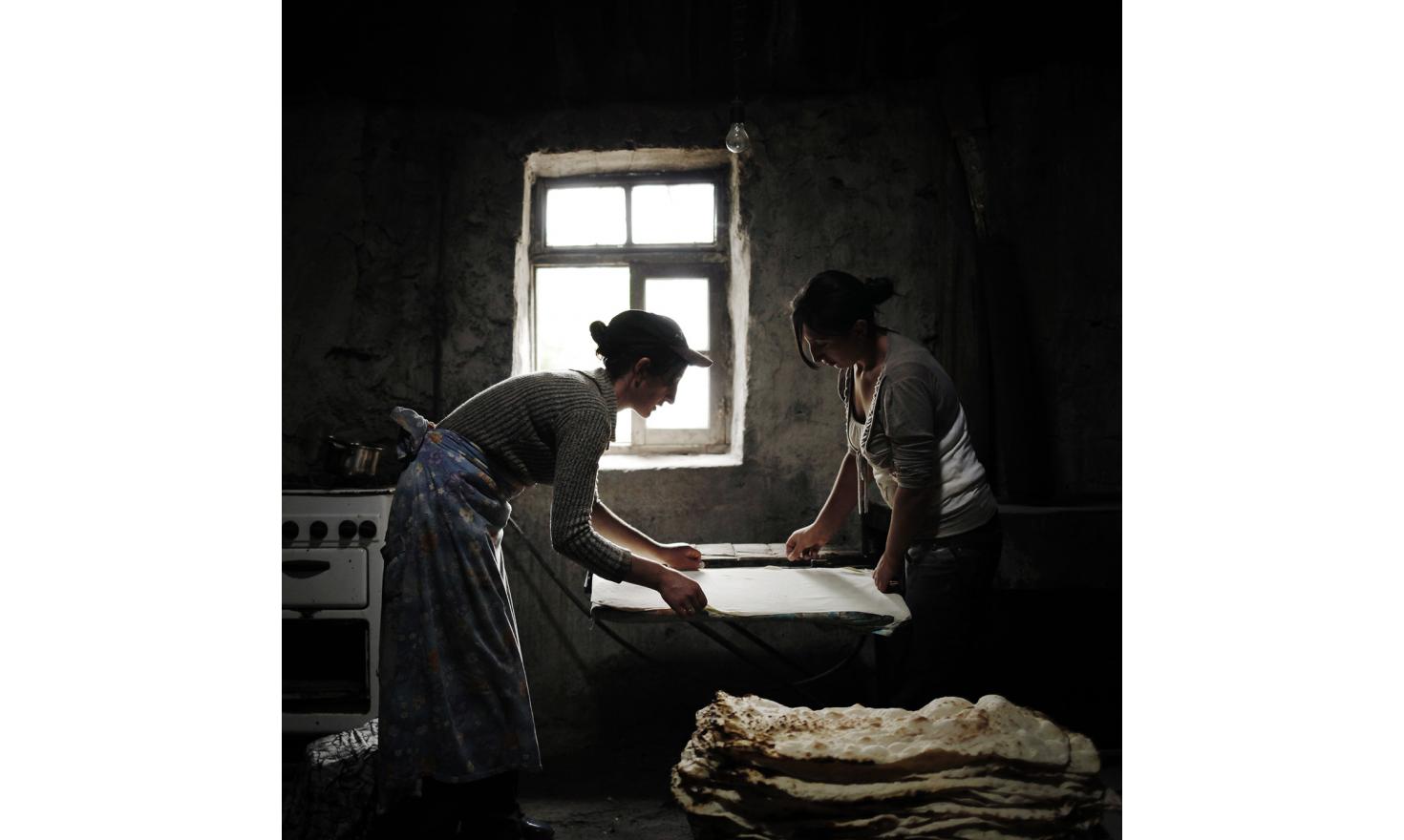 Anoush and Ruzanna, prepare lavash, the traditional Armenian bread. Women prepare it in large quantities and then keep it for one or two weeks. It's a way of saving money. Their husbands are brothers and both work in Russia.