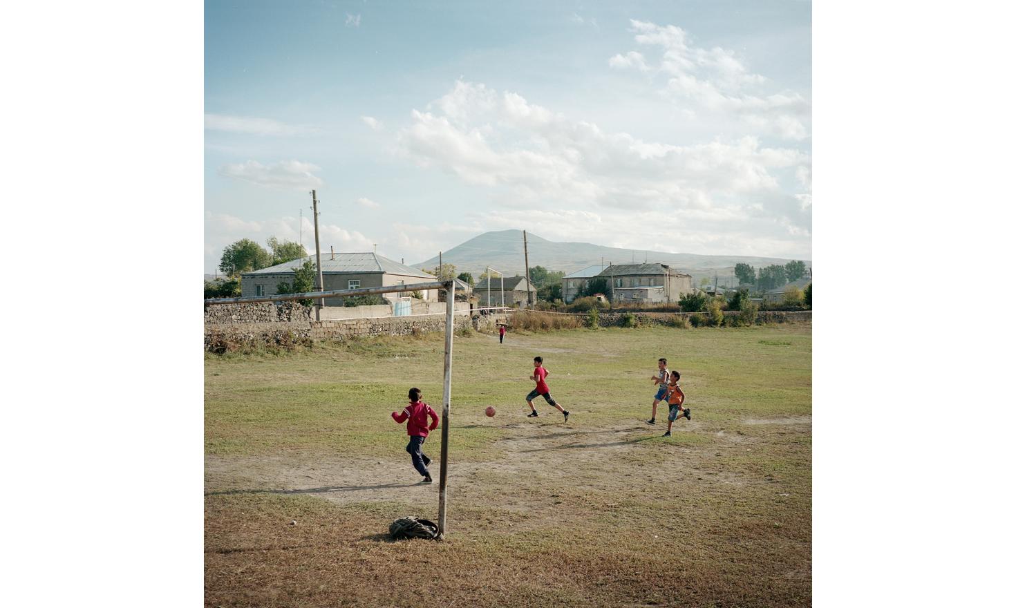 The football field of the village. There are no sports club in Lichk except boxing for boys and dance for girls, but children improvise games.