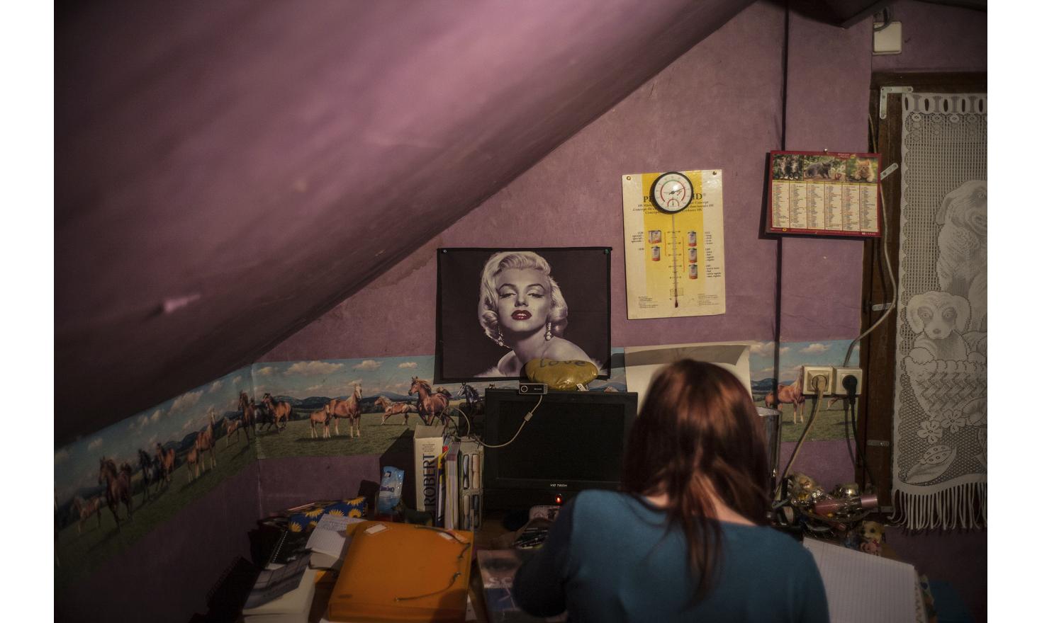 ©Ulrich Lebeuf / M.Y.O.P Amandine is doing her homework in her room.