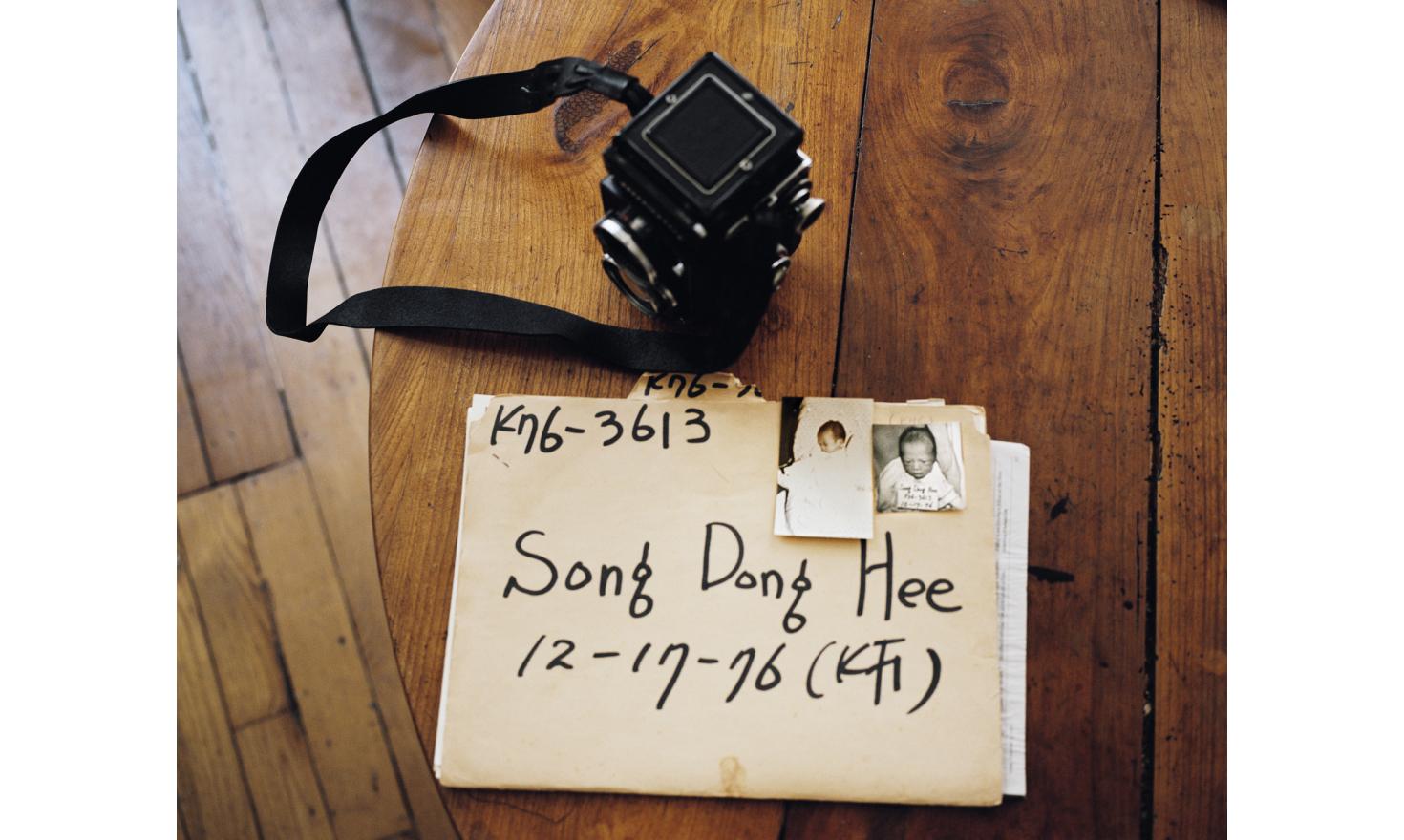 © Agnès Dherbeys / MYOP Father and Mother Unknown - Paris July 2013. My file of pre-adoption from South Korea. My parents gave it to me when I turned teenager. It has very few information, mainly medical reports and this note: father and mother unknown.